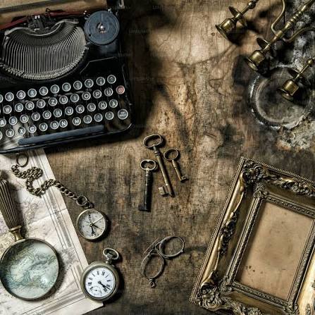 Antique typewriter, pocket watches, and keys representing memories of the past